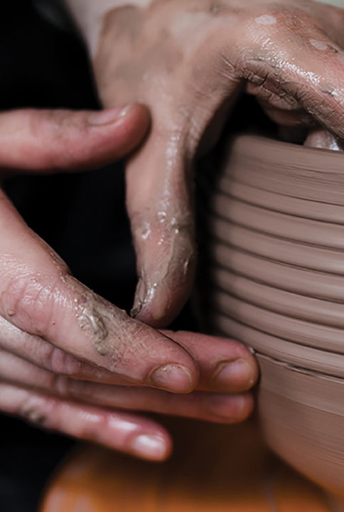 Hands working on pottery wheel. Sculptor, Potter. Human Hands